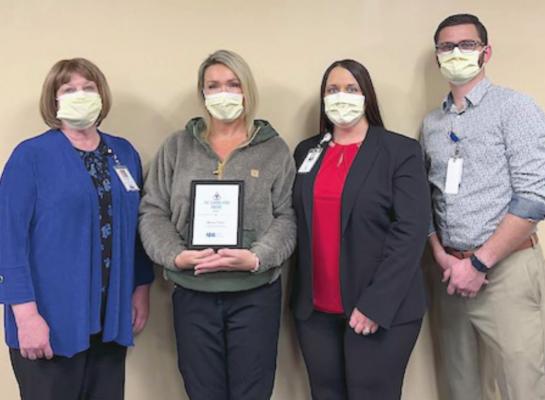 Pictured in the Caring Kind Award Presentation are Diana Swindler, Chief Financial Officer; Rena Farr Caring Kind Award Winner; Jessica Fisher, Chief Executive Officer; and Clay Jordan, Chief Nursing Officer.