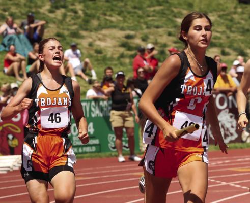 Rachel Harris of Cambridge cheers on her teammate, Jalen Kent, after handing off the baton in the 4x1.