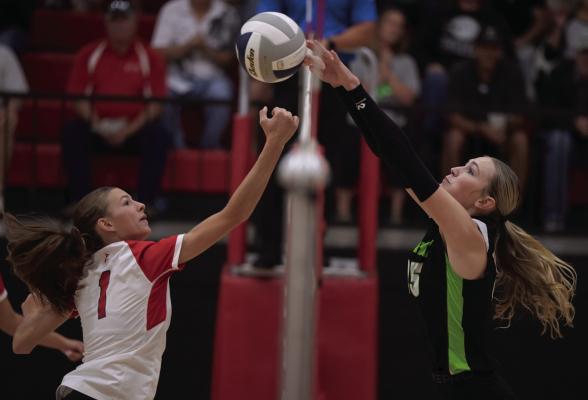 MHC’s Addison Richards rejects a Valentine attacker.
