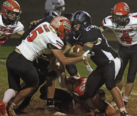 Cambridge’s Tate Koeppen meets a runner at the line.