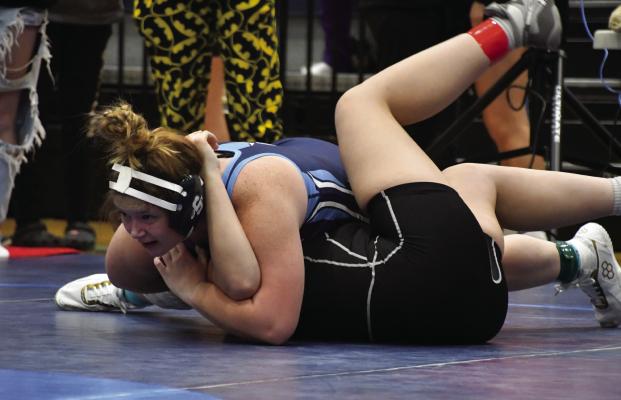 Southwest’s Ashlynn Latimer finishes a pin at Friday’s Southwest Invite.