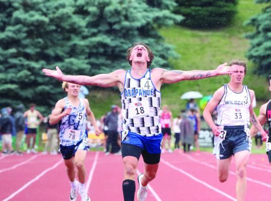 Arapahoe’s Will Cacy crosses the finish line first to take gold in the 400-meter dash, one of four medals Cacy won at the State Track Meet in Omaha.