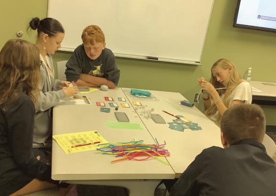 Youth engaging in the “Brain Game” during Science of Child Development.