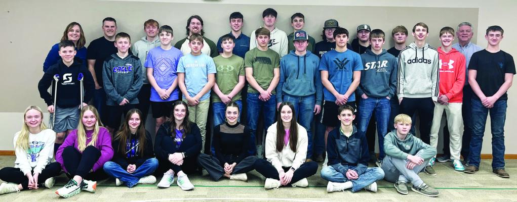 Former Cornhusker linebacker Nick Henrich stands with students in the Life Choices group in Oxford where he spoke with them on Sunday, February 18 at the Evangelical Free Church. Henrich is seen in the back row, fourth from the left.