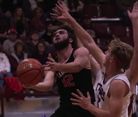 Krayton Ruggles scoops a layup under a DCS defender.