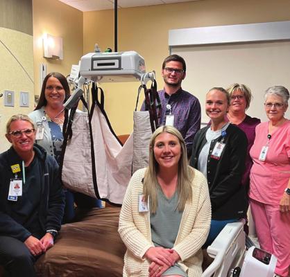 Pictured with the patient lift and warmers are Jessica Fisher, CEO; Clay Jordan, CNO; Jamie Vontz, Foundation Director; Kristi Shoemaker, RN; Justine Brott, RN; Dixie Jauken, RN; and Marge Paisley, CNA.