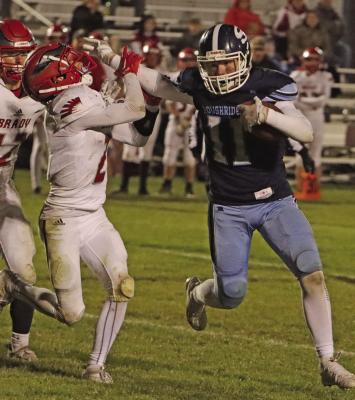 Southwest’s Hunter Blume stiffarms a Brady defender.
