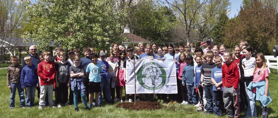 Arapahoe students learn about planting a tree for Arbor Day