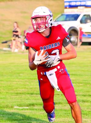 Med Valley’s Brody Senff escapes on a 52-yard touchdown run.