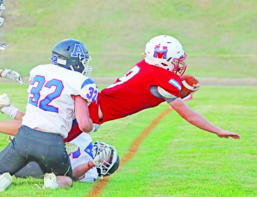 Mason Roblee dives for the end zone.