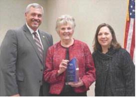 Jerda Garey Vickers (center) was honored over the weekend by Mid-Plains Community College as 2026 Distinguished Alumnus. She is joined by MPCC President Ryan Purdy (left) and Courtney Wittstruck, executive director of the Nebraska Community College Association.
