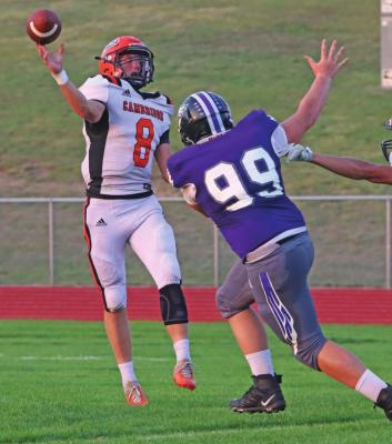 Cambridge’s Derek Trompke throws under pressure from Southern Valley’s Colby Noel Friday night.
