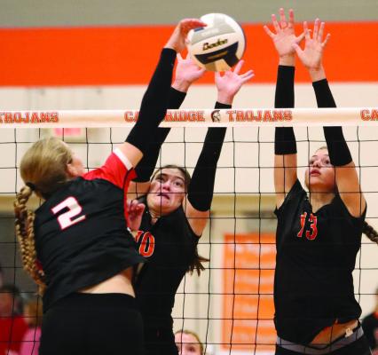 Cambridge’s Elisabeth Kubik and Annabelle Taylor combine to stuff a Franklin attacker Tuesday.