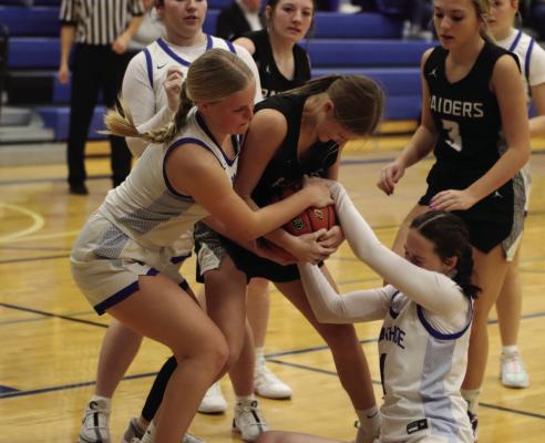 Emma Strand ties up a Lawrence-Nelson rebounder.