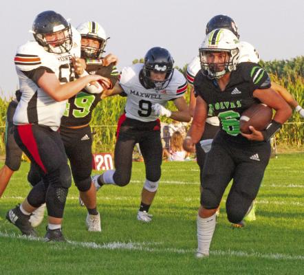 MHC’s Kody Schwenk turns the corner on a run against Maxwell.