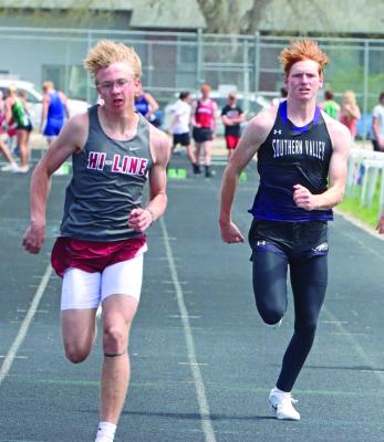 Hi-Line’s Finn Kerznar and Southern Valley’s Tylor Grove approach the finish in the 100 prelims. Kerznar eventually finished third in the event.