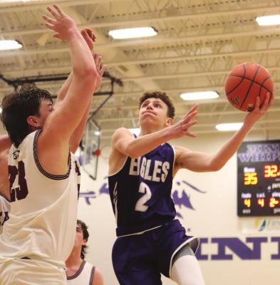Southern Valley’s Kamden Bose rises for a shot, challenging a BDS shot-blocker in Monday’s district final.