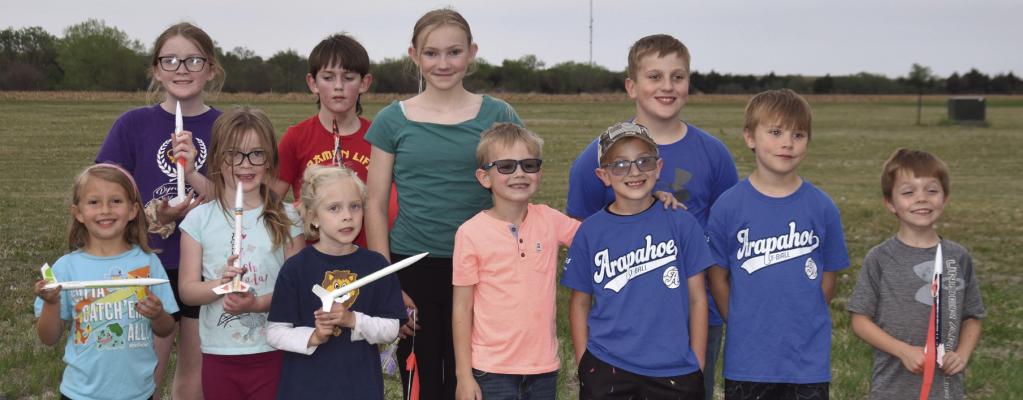 Arapahoe Cub Scout Pack 126 launching rockets were back (l-r) Molly Leising, Aiden Steinhour, Emma Houser, Jaxtyn Soncksen. Front (l-r) Whittlee Dodson-Funke, Kaylee Leising, Phoebe Leising, Owen Houser, Jentzen Soncksen, Ryker Stark and Adam Dettman.