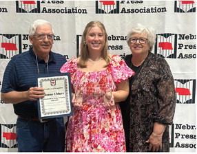 Jenna Ebbers is pictured with her grandparents, Jim and Judy Jackson of Cambridge after she received her award at a luncheon in Kearney Saturday during the Nebraska Press Association’s Annual Convention.