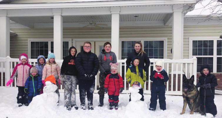 Snowstorm brings more work, play