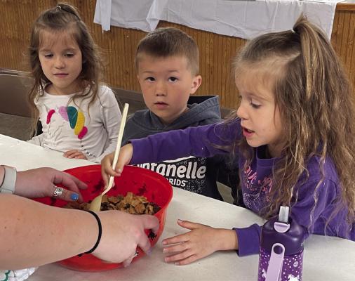 Stirring up a snack at Clover Kids Camp.