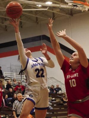 Arapahoe’s Suttyn Shafer scores around Hi-Line’s Shelby Jurjens.