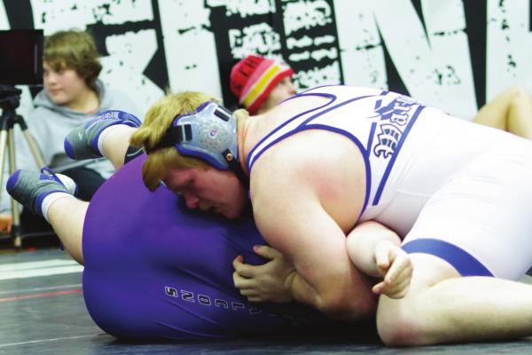 Arapahoe’s Levi Kerner (above) earned his fourth RPAC Championship and Austin Warburton (below) competed at the RPAC Meet Friday.
