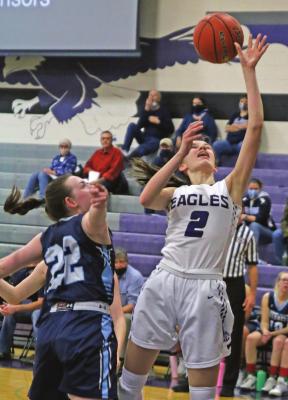 Southern Valley’s Ann Bose lays a shot off glass over Southwest’s Caylin Barnett.