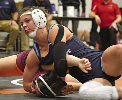 Southwest’s Ambie Custard (above) remained unbeaten with a district title Saturday while Southern Valley-Arapahoe’s Brooke Lentz (below left) and Southwest’s Capri Sayer (below right) each qualified as well.