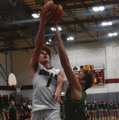 ABOVE: Hi-Line’s Ryker Evans goes in for a layup. BELOW: The Bulls’ Cade Schmidt rises for a jumper.