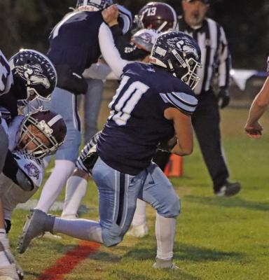 Southwest’s Damario Koetter blasts through the line into the end zone against Lewiston Friday.