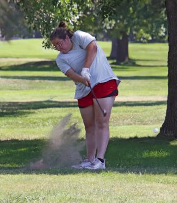 Southwest’s Maddy Tryon drills an iron shot from the rough.