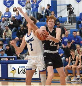 Southern Valley’s Tylor Grove battles for a rebound at Bertrand.