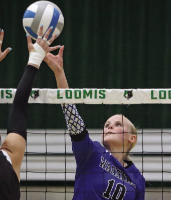 Arapahoe’s Emma Strand, pictured at last week’s triangular against MHC, had 27 kills at Saturday’s tournament.