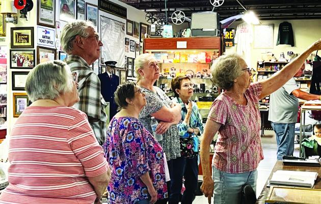 Museum Board member Nancy Knuth shows members of the Furnas County Genealogical Society details of the 1935 flood on a large map of the Republican River. Society members pictured are: Rua Johnson, Don Nitzel, Kathy Trosper, Cheryl Haakenson,Shirley Vollmer