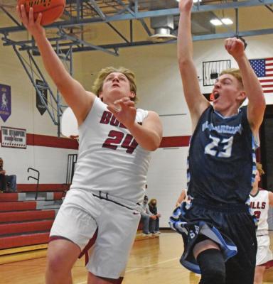 Hi-Line’s Cade Schmidt scores over a shot-challenging Hunter Cunningham.