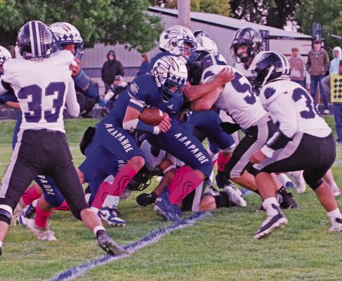 Arapahoe’s Kade Fisher carries the ball up the middle.
