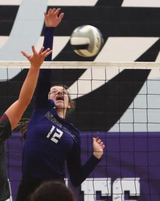 Southern Valley’s Ann Bose blasts an attack off an overpass.