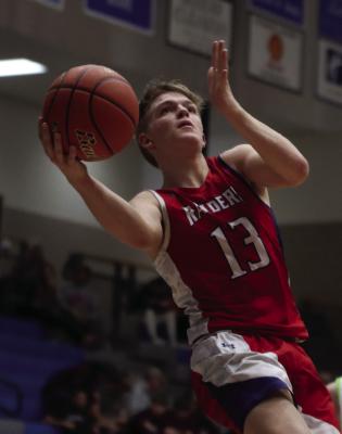 The Raiders’ Mason Roblee puts up a shot inside.