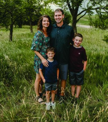 New Cambridge principal Mike Nanfito is pictured with his wife, Miranda, and their two sons, Marshall and Miles. Photo credit: Rachel Ann Photography