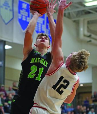 MHC’s Haydn Farr scores inside over an Alma defender.