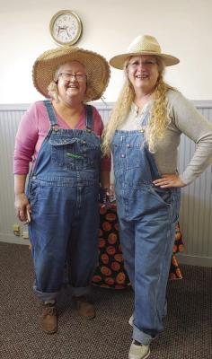Dressing up as hillbillies on Halloween at First Central Bank, Edison is Lori Moore and Nancy Jochem.