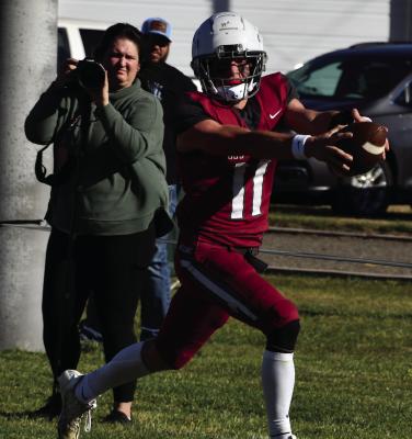 The Bulls’ Ryker Evans reaches for the end zone on a touchdown run.