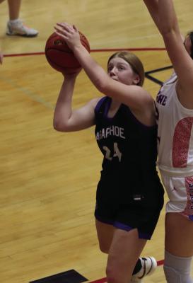 Arapahoe’s Clara Hilker tries to score inside.
