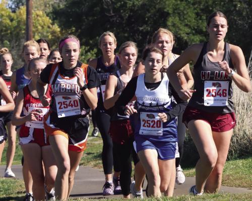Cambridge’s Jensyn Weiss, Arapahoe’s River Einspahr and Hi-Line’s Genesee Knackstedt lead a second group of runners at the District D-5 Meet in Cambridge Thursday.