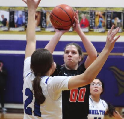 Cambridge’s Schyler Hoberty launches a jumpshot.