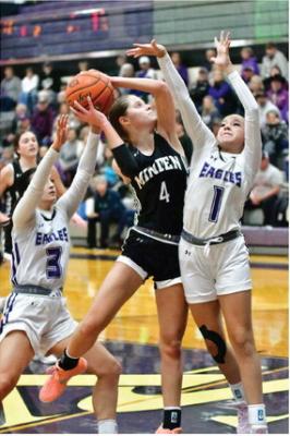 Brecklyn Hammond and Vaensa Aguayo challenge a Minden shot in the paint.