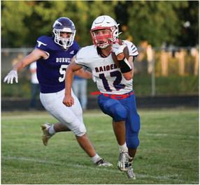 Medicine Valley’s Brody Senff looks for running room around the edge. Photo by KC Creations Photography.