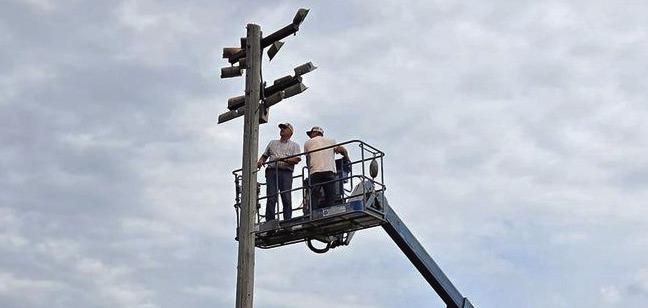 Kevin and Heath Weichel installed new lights on a man lift.
