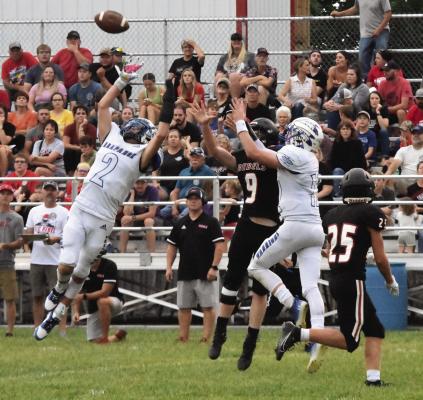 Arapahoe’s Kade Fisher and Trenton Roskop break up a deep pass attempt by Arcadia-Loup City.